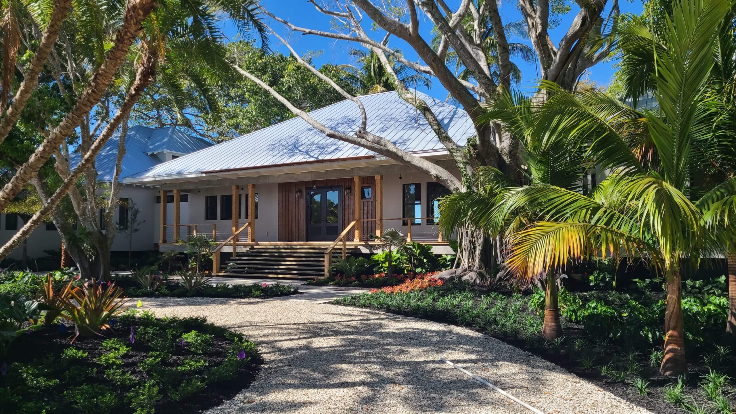 Tropical house with lush garden landscaping.