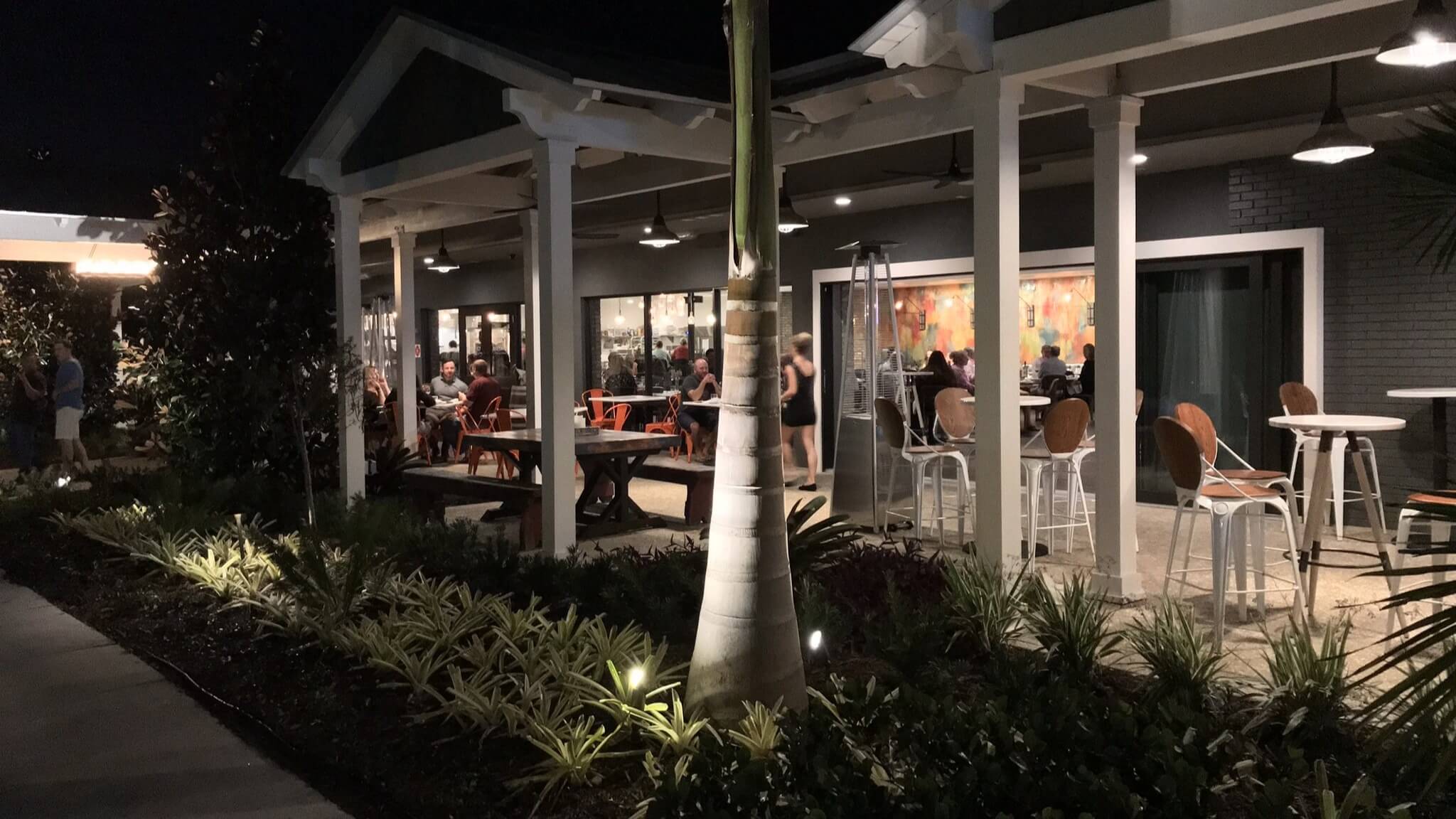 Outdoor restaurant seating area at night.