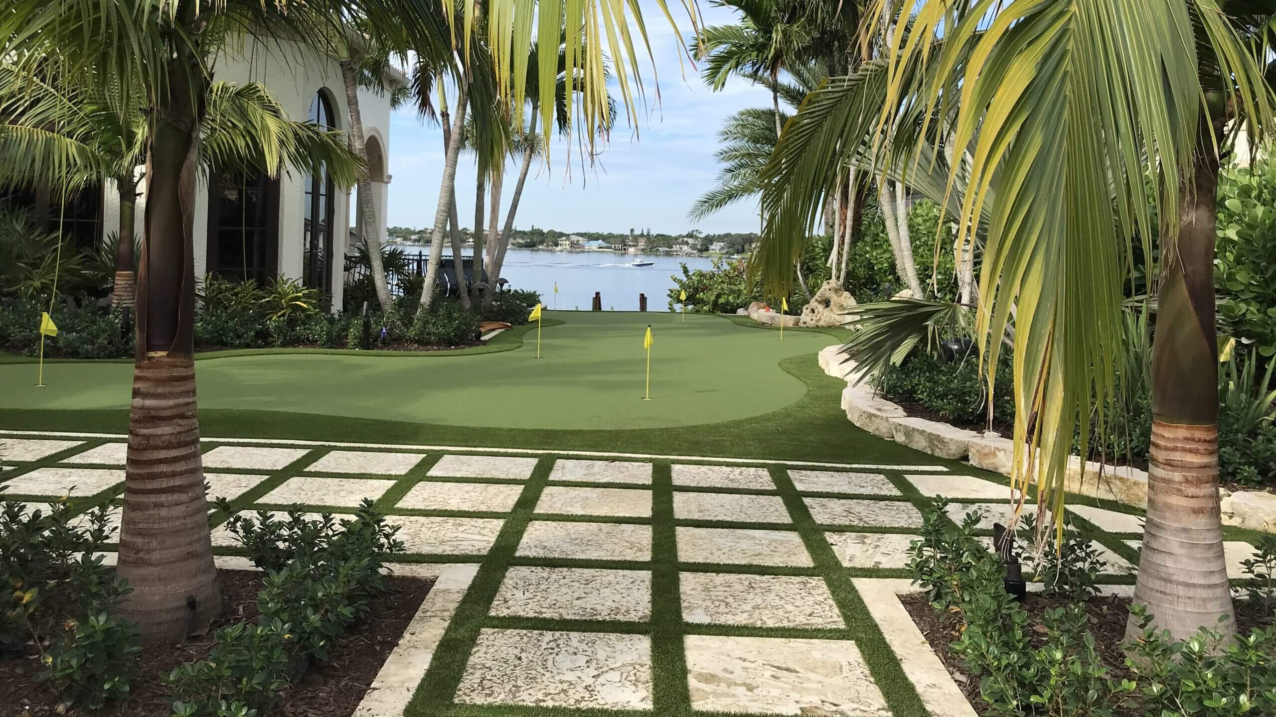 Tropical garden with golf putting green.
