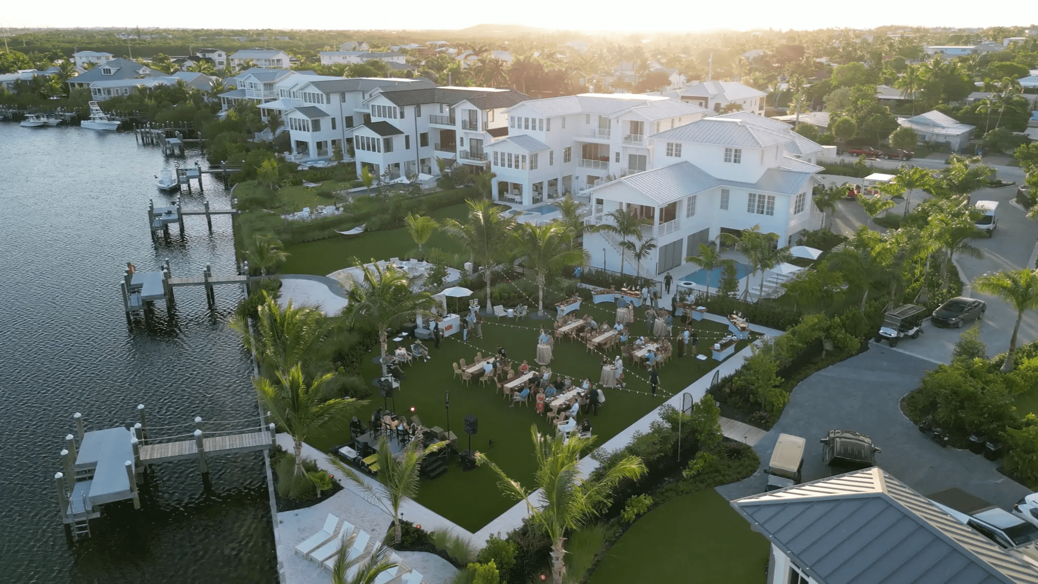 Waterfront homes with a garden gathering event.