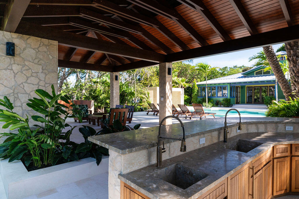 Outdoor patio with pool and garden view.